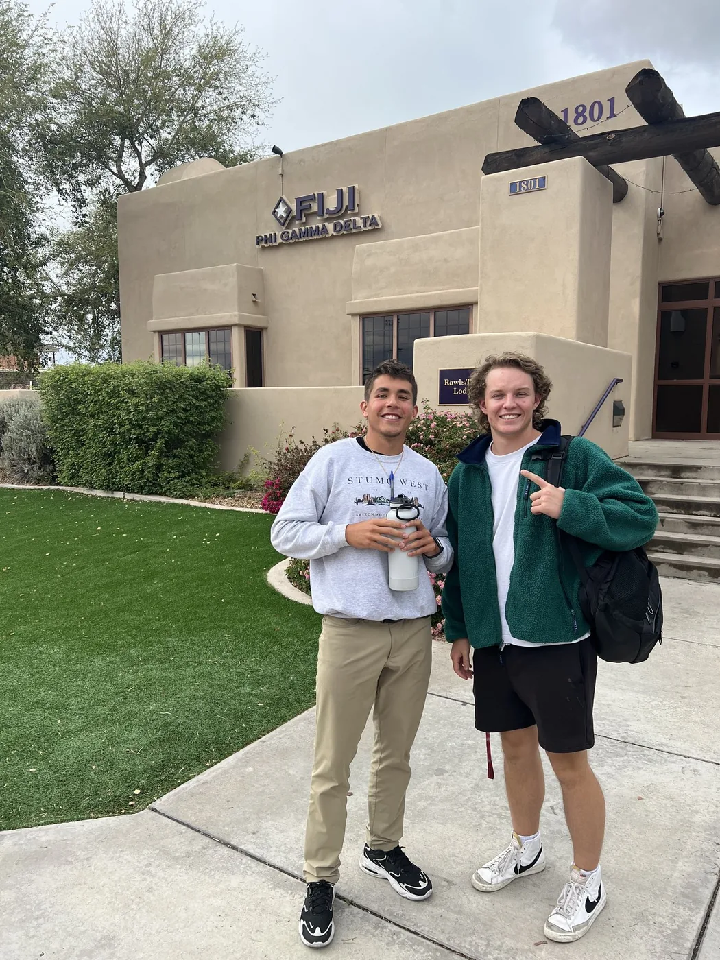 Blake and Noah in front of the Fiji fraternity house at UofA